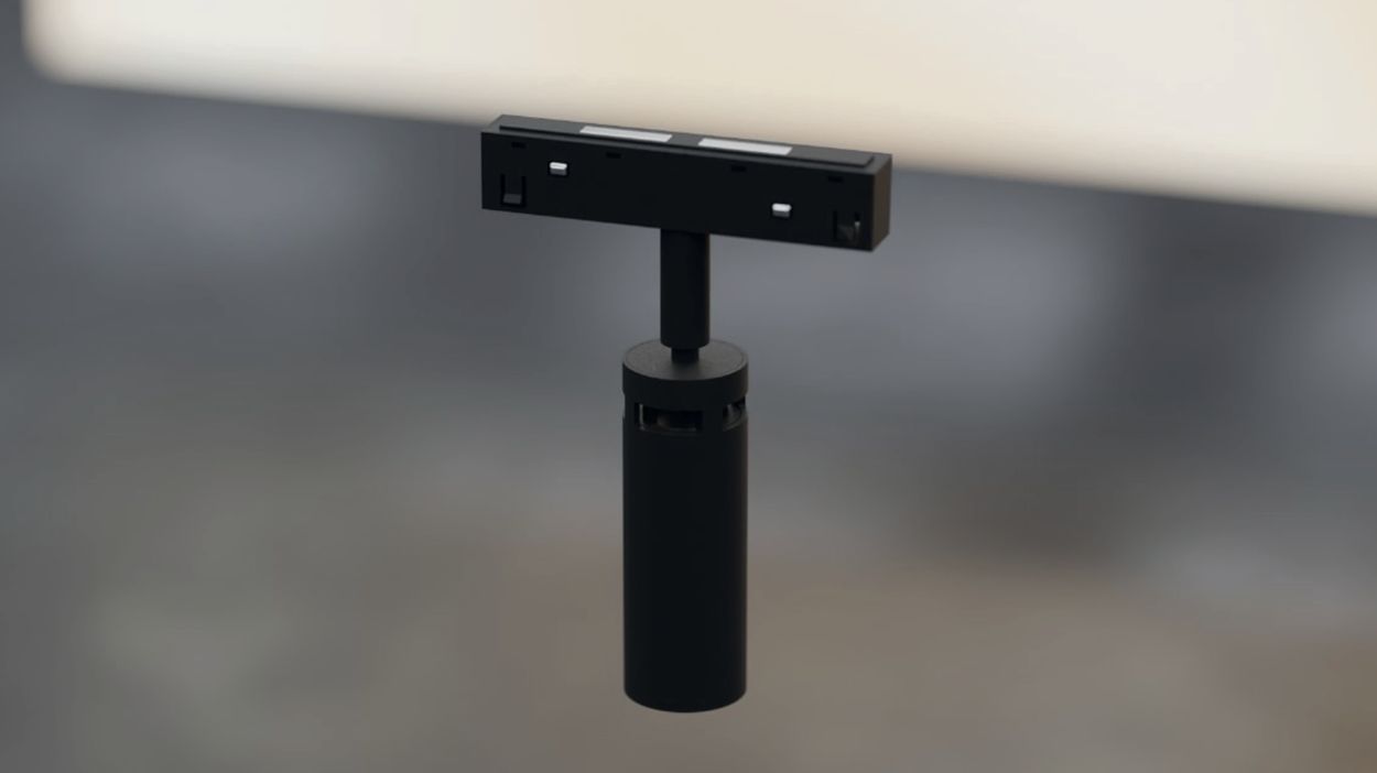 Черный цилиндрический модуль на треке в интерьере