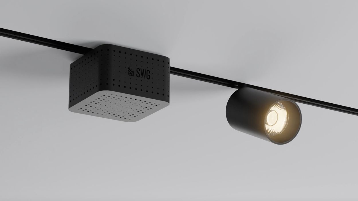 Адаптер в треке рядом с цилиндрическим трековым светильником